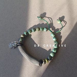 Handmade African turquoise with cara horn and sterling silver pendant bracelet